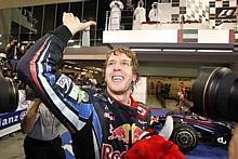 Formel-1-Weltmeister Sebastian Vettel freut sich nach dem Finale in Abu Dhabi. Foto: L. Gorys/Auto-Reporter.NET